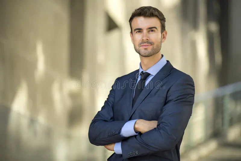 files/business-man-standing-confident-smile-portrait-successful-suit-smiling-proud-outdoors-44304293.webp